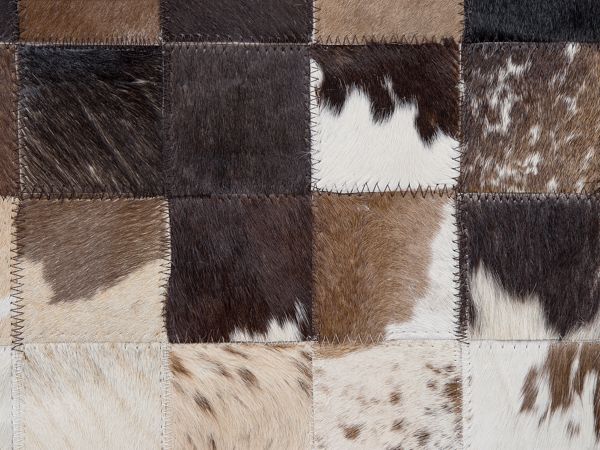 Beliani Δερμάτινο χαλί συνονθύλευμα 140 x 200 cm καφέ και μπεζ OKCULU 8497449 4251682206952